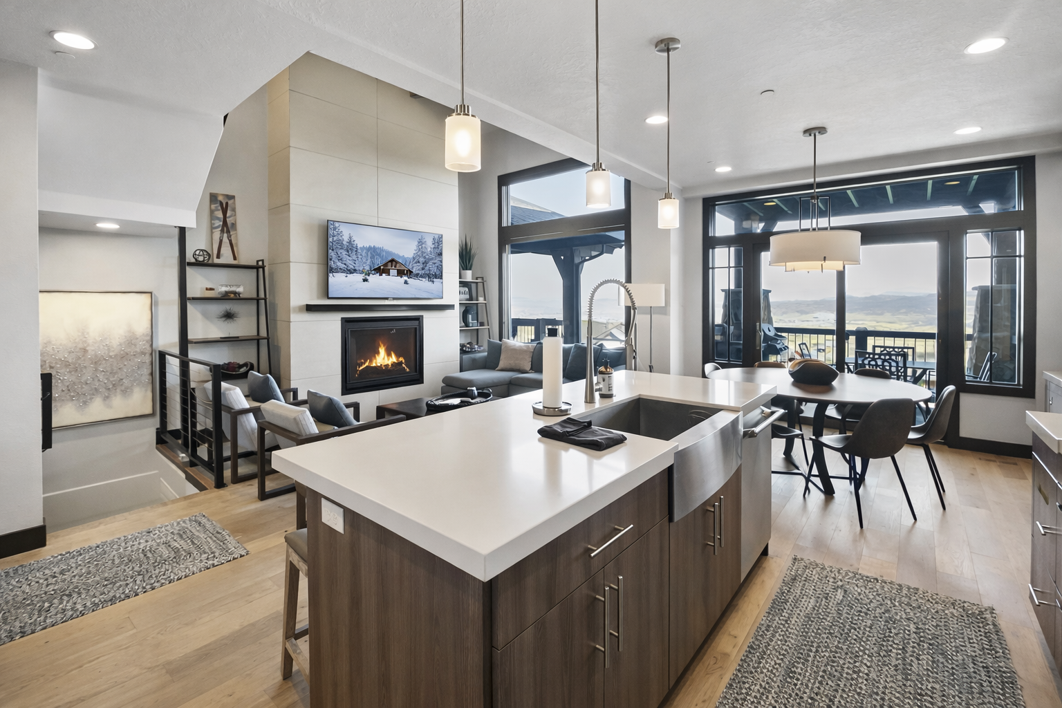 Your stunning open-concept retreat blends modern luxury with warmth—cook in the gourmet kitchen while enjoying the cozy fireplace and breathtaking views.