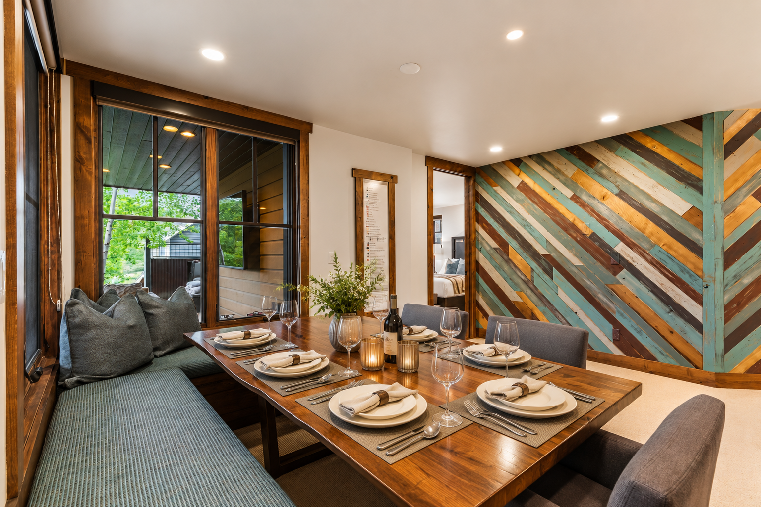 Gather around this handcrafted dining table, where reclaimed wood wall art and warm wood tones set the stage for memorable meals together.