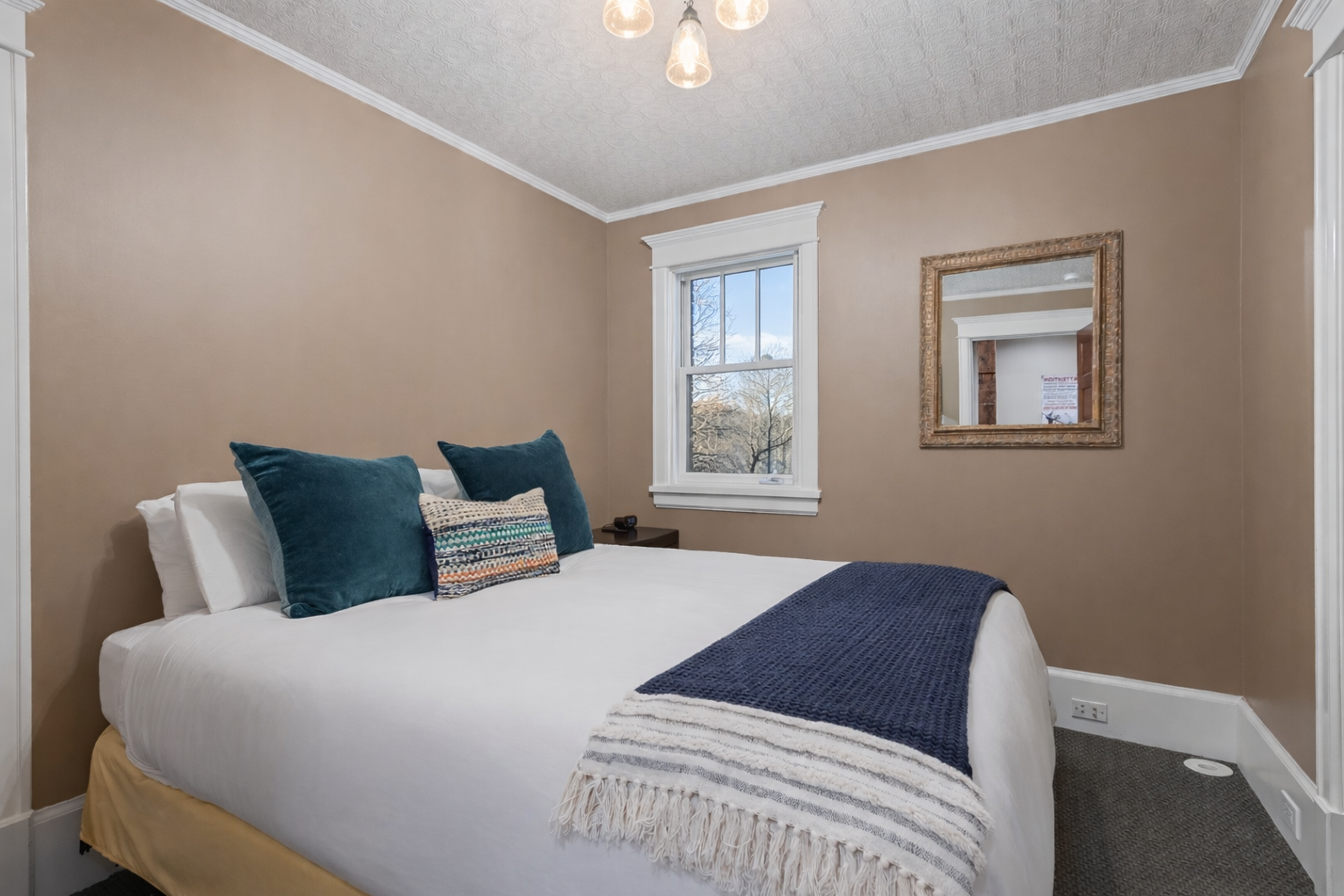 Sink into soft linens and plush pillows in your peaceful bedroom sanctuary, where natural light and thoughtful touches create the perfect retreat.