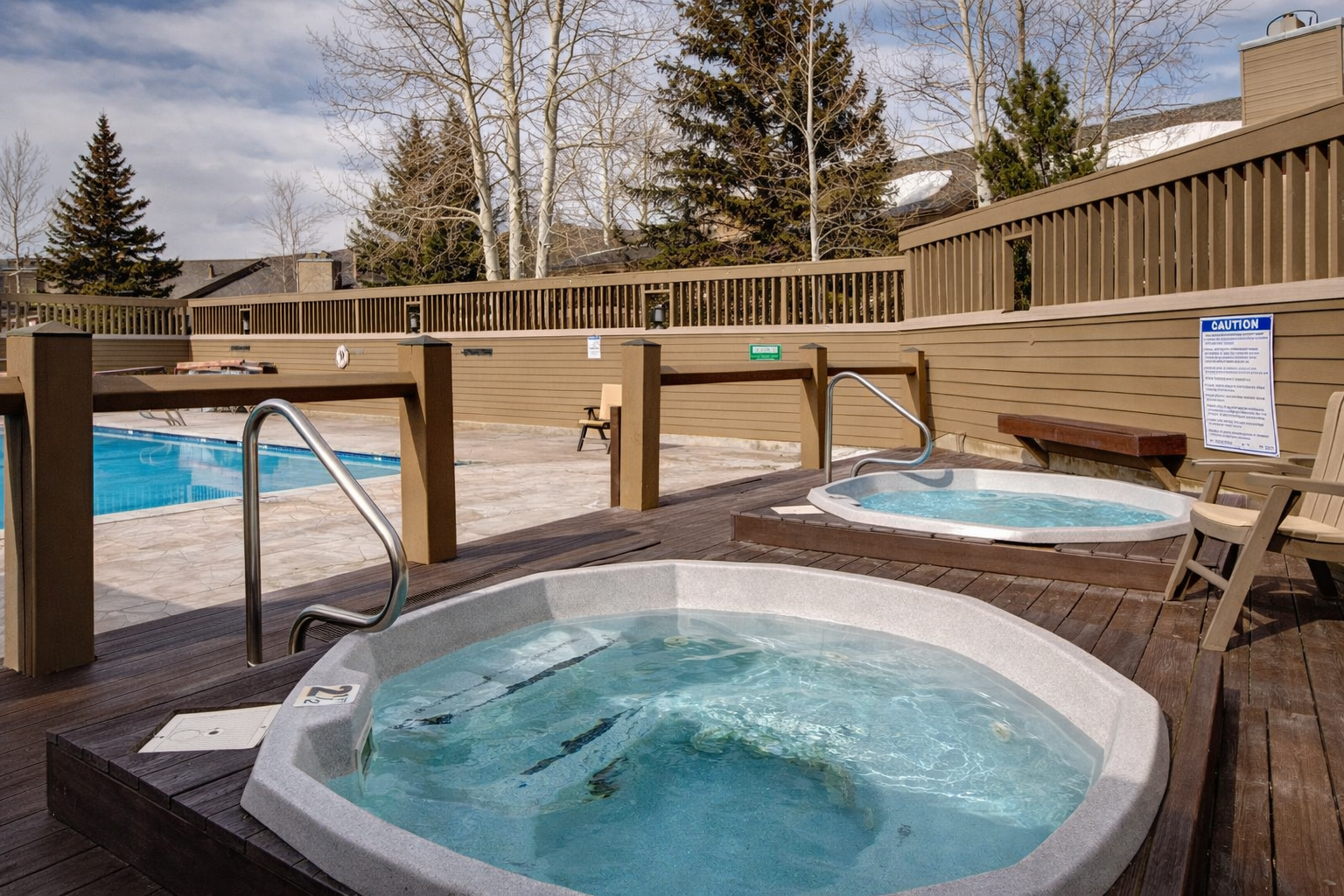 Relax and unwind in our community outdoor hot tubs and sparkling pool after a day of adventure. Your perfect mountain oasis awaits.