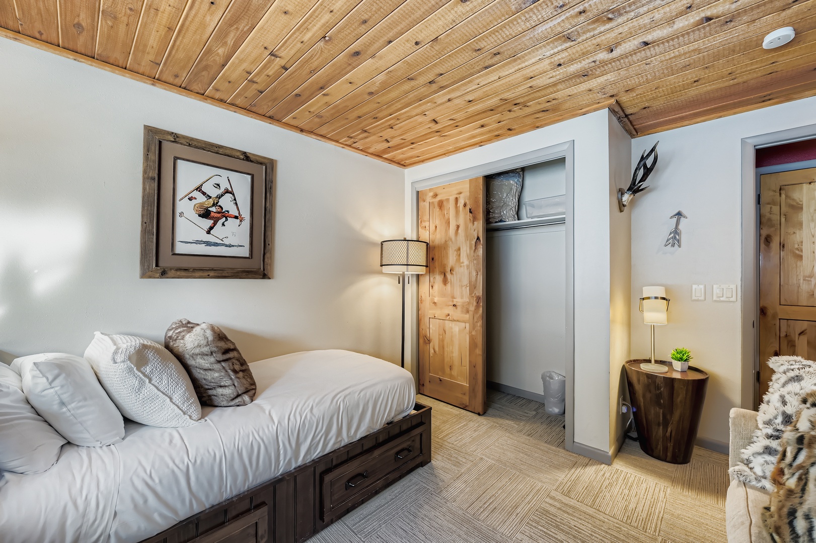 Unwind in your cozy retreat with rustic wood ceilings, soft linens, and warm alpine charm. Your perfect mountain getaway awaits.