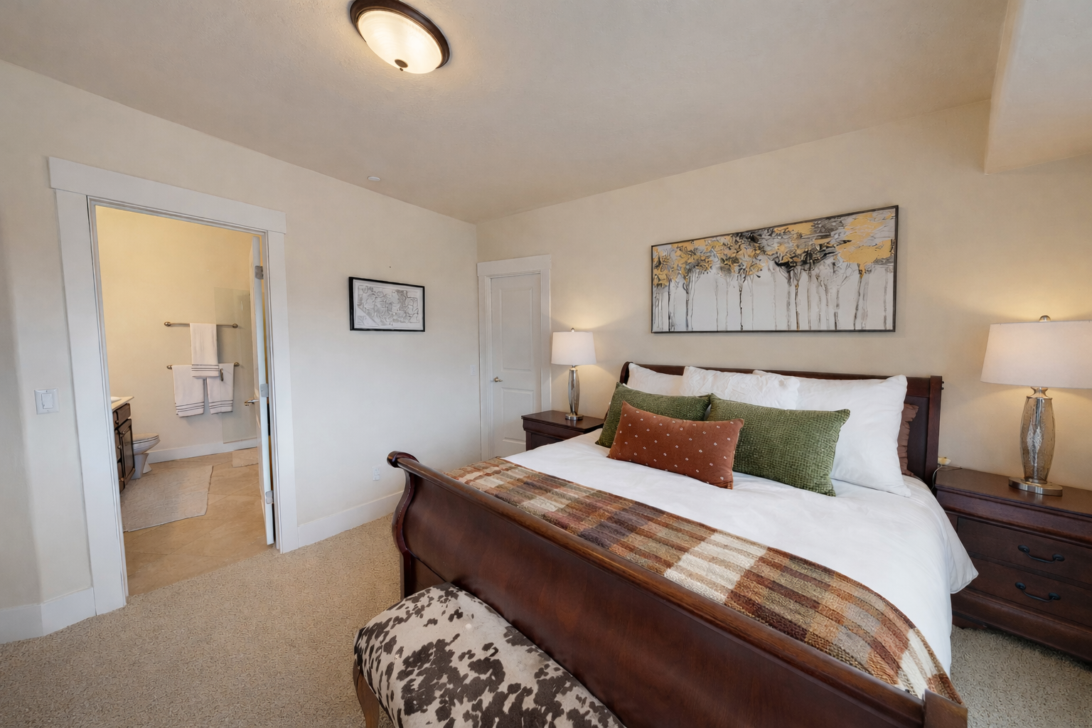 Your private bedroom sanctuary features crisp linens, warm wood furnishings, and thoughtful accents that invite peaceful nights and restful mornings.