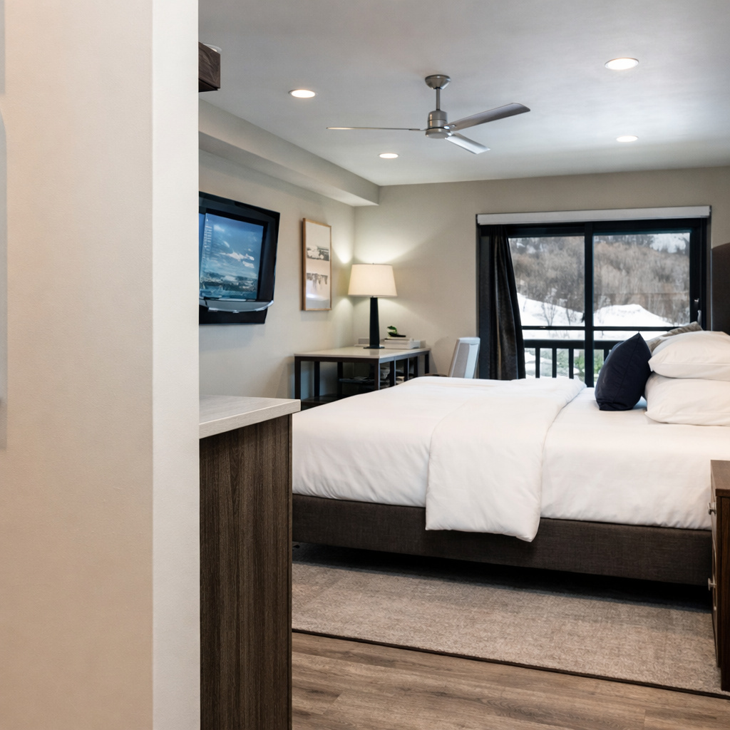 Luxury mountain escape! Modern bedroom suite with a king bed, kitchen, and balcony views. Easy access to skiing, hiking, and town.