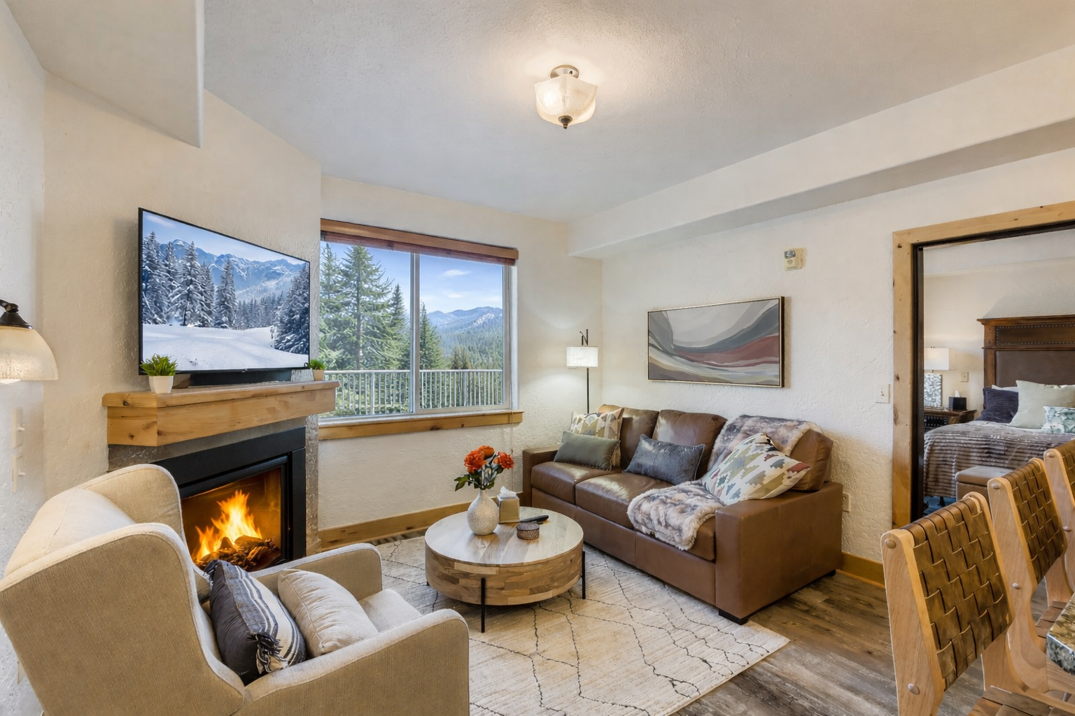 Relax in this stylish mountain retreat featuring a cozy gas fireplace, flat-screen TV, and plush seating. Enjoy an open layout just a short walk to ski lifts.