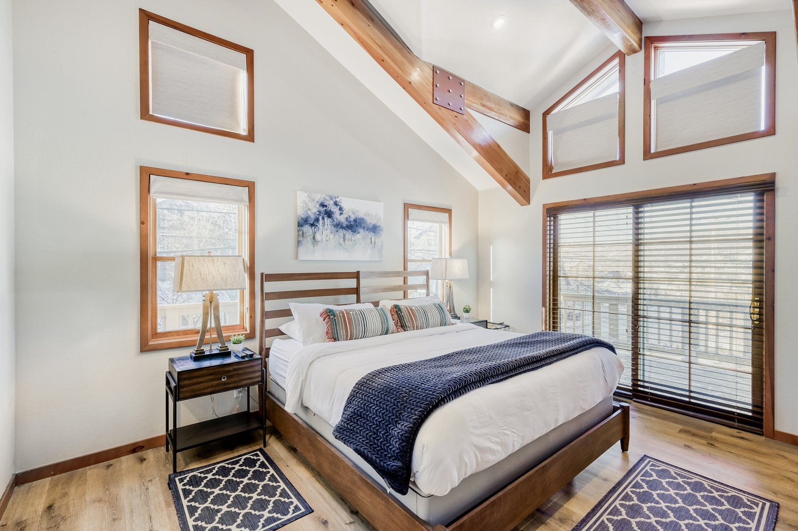 Rest peacefully in your bright bedroom where exposed beams and skylights create an airy retreat with crisp linens awaiting.