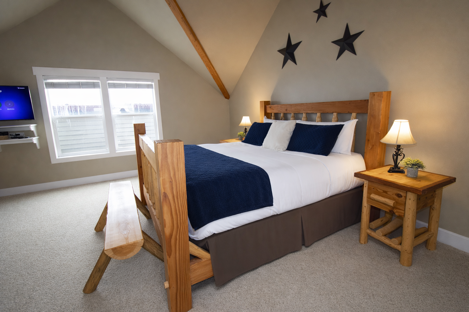 Relax in this spacious master suite on its own private floor. Features include a king-sized log bed, vaulted ceilings, and a large walk-in closet for the ultimate mountain retreat.