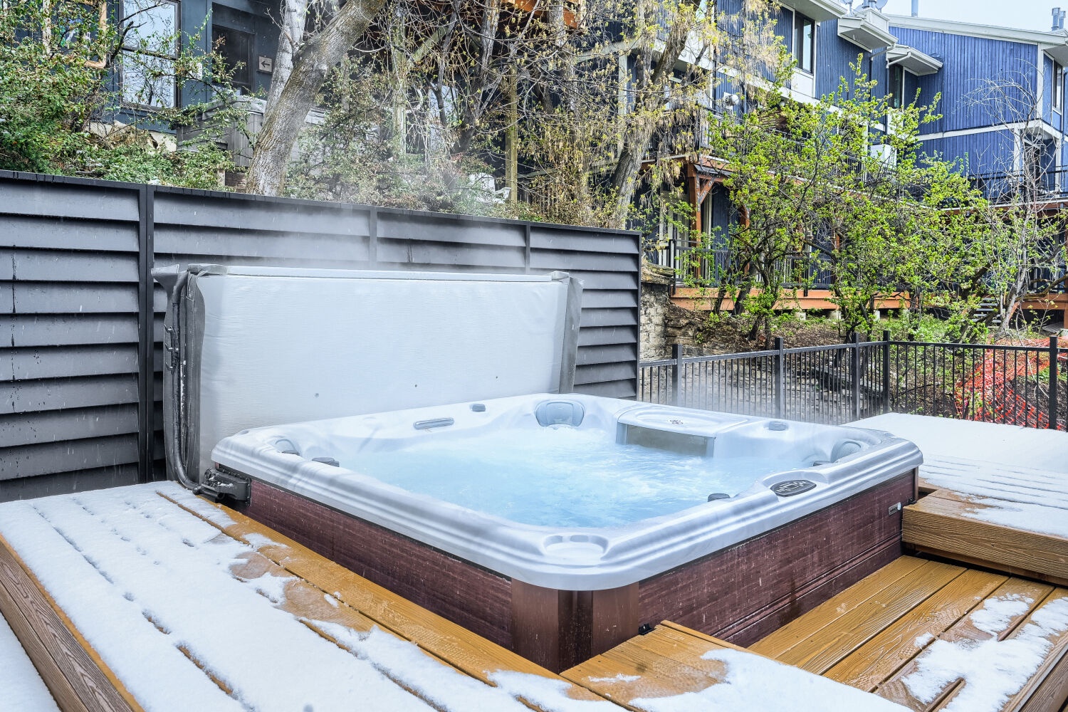 Soak your worries away in the hot tub, surrounded by peaceful neighborhood views and fresh mountain air.