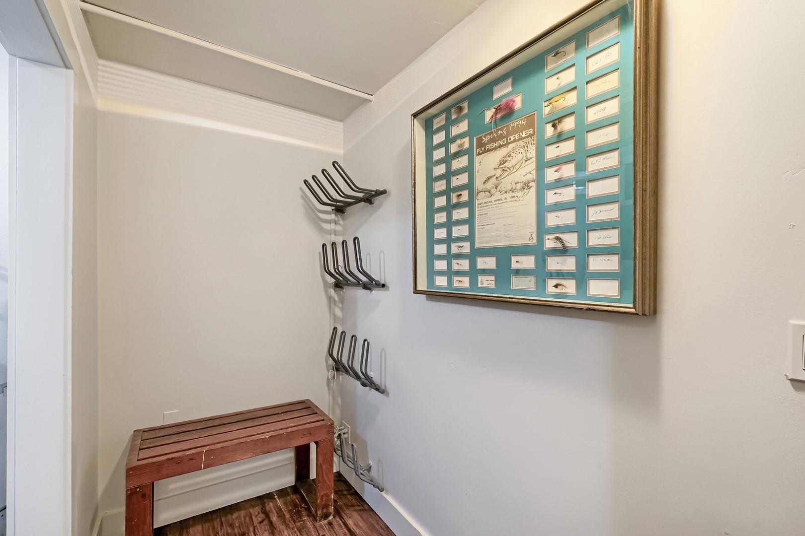 Your personal mudroom awaits with wall hooks for coats and gear, plus a handy wooden bench—perfect for slipping off shoes after a day of exploring.