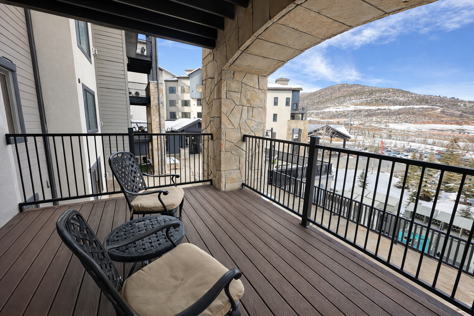 Step onto your private balcony and soak in stunning mountain views while savoring morning coffee in comfortable seating.