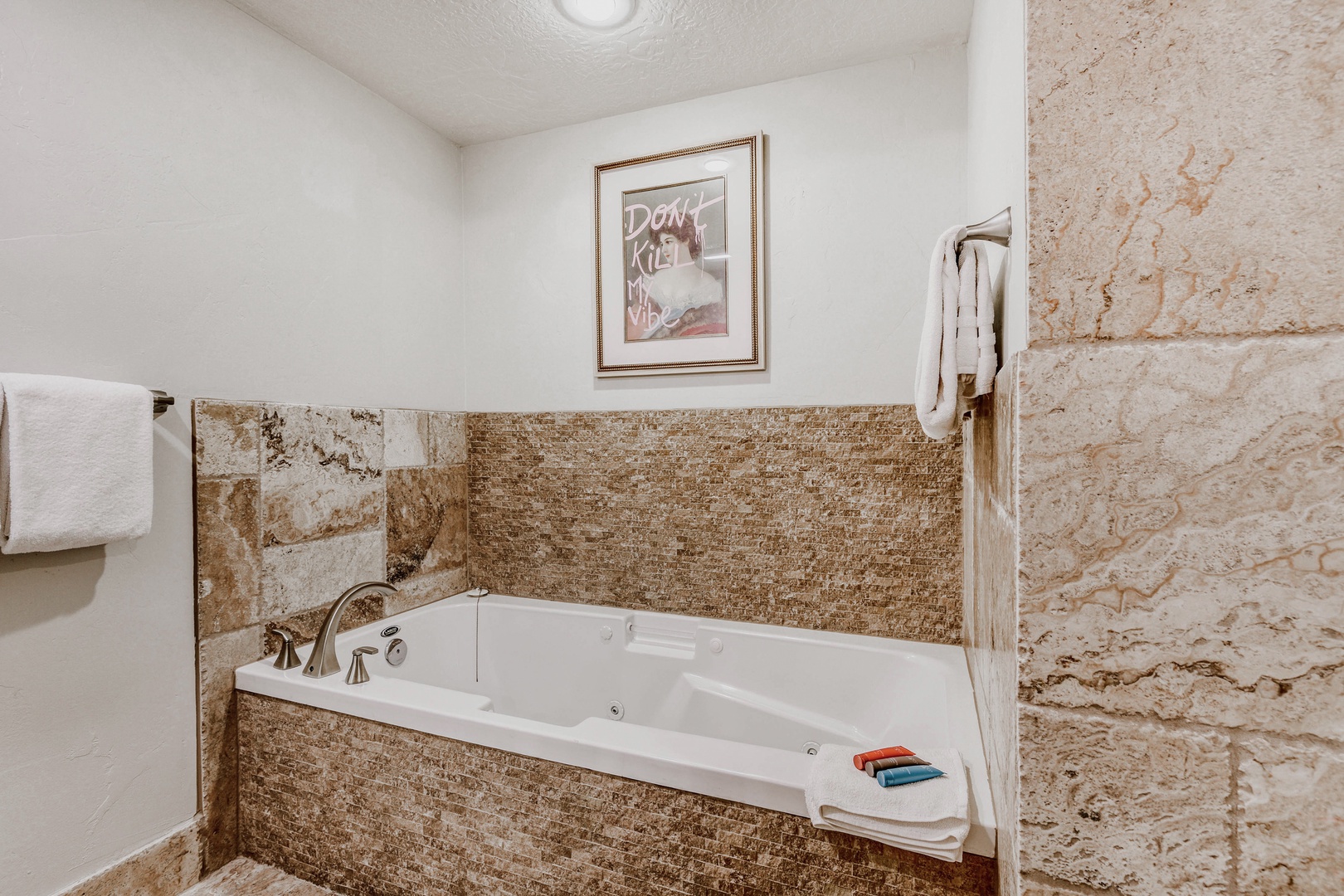 Slip into your private jetted tub after a day of adventure and let the warm bubbles melt away every care. Plush towels and spa-inspired stone surround your escape.