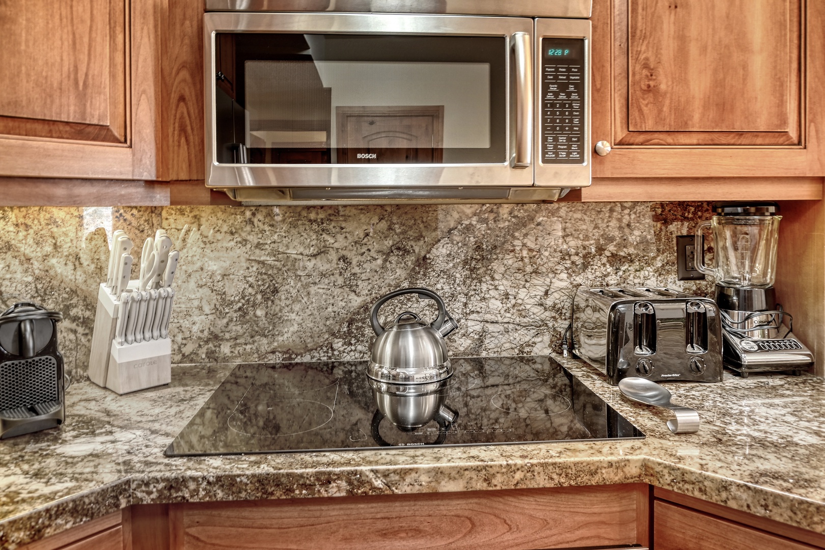 Your gourmet kitchen features granite countertops, stainless steel appliances, and everything you need to create delicious meals during your stay.
