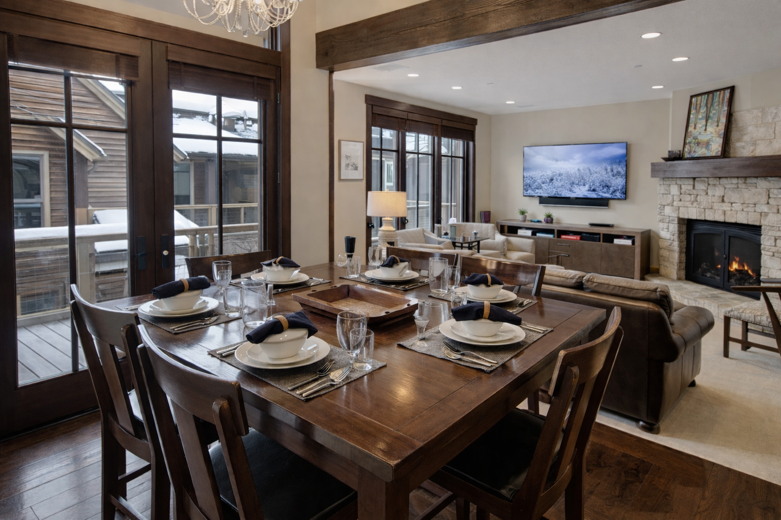 Gather around this elegant dining table set for memorable meals while the fireplace crackles warmly nearby, creating perfect moments for your group.