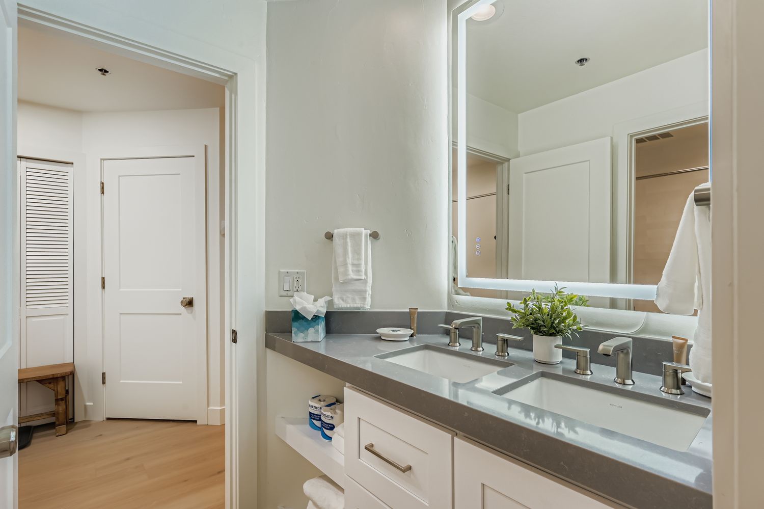 Refresh in your spacious dual-sink bathroom featuring modern fixtures, premium countertops, and thoughtful amenities for your comfort.