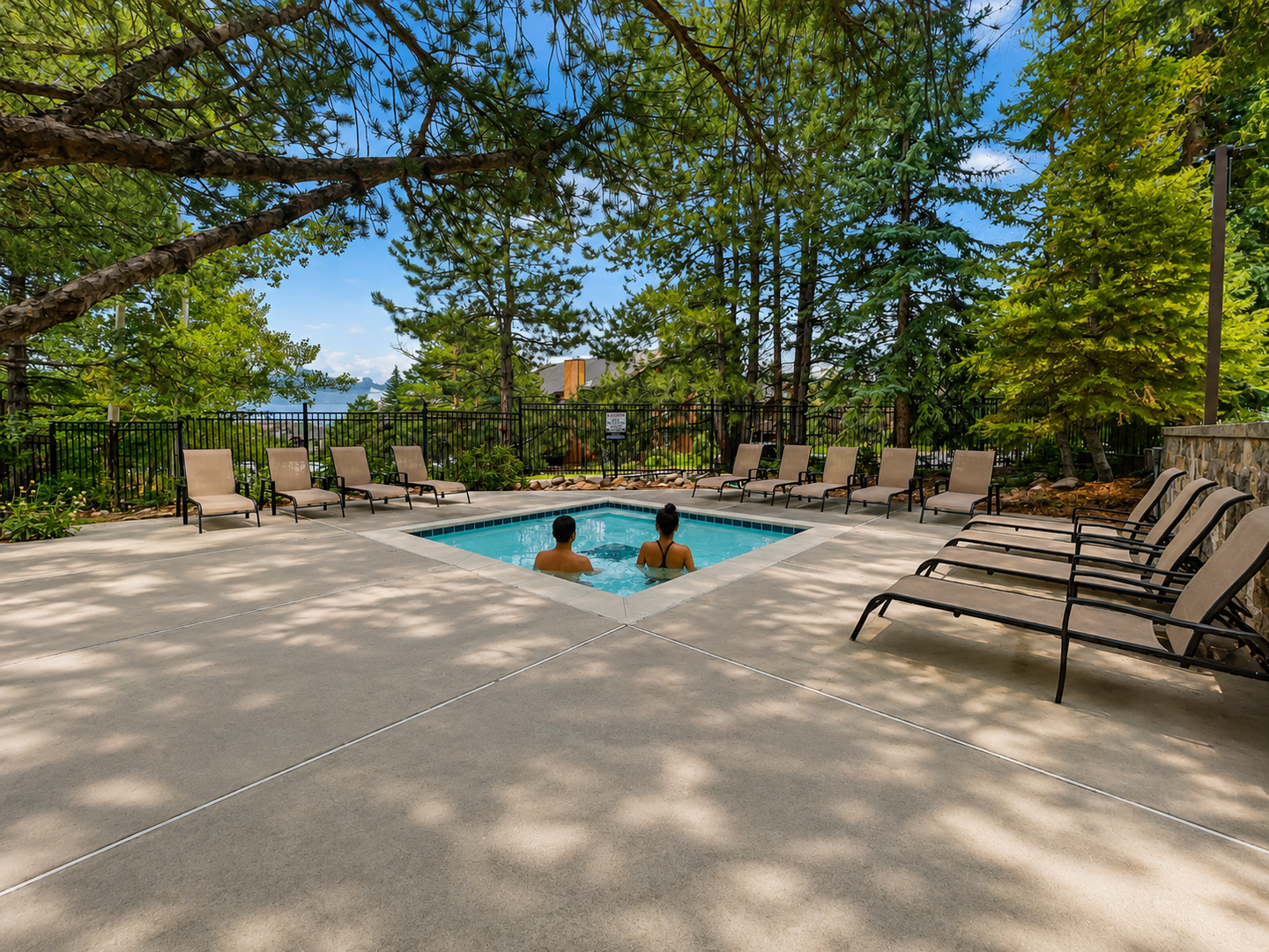 Community Outdoor Hot Tub -Soak away your cares in the hot tub under a canopy of towering pines, with plenty of lounge chairs nearby for your comfort and relaxation.