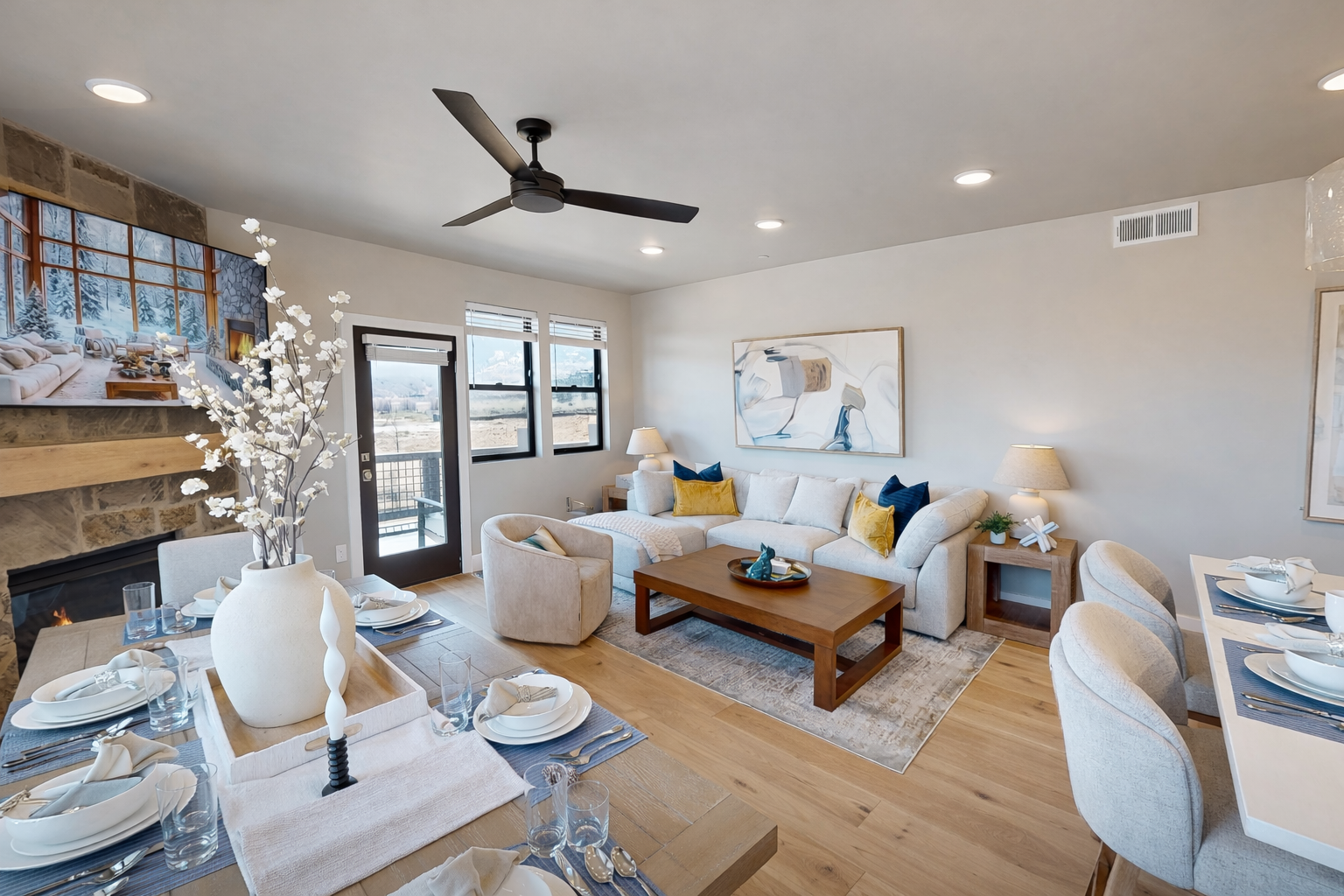 Relax in your stylish open-concept space where modern comfort meets warmth, featuring a cozy fireplace and seamless indoor-outdoor flow.