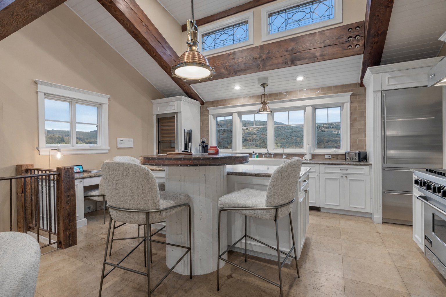 Gather around this stunning kitchen island where rustic beams meet modern elegance, perfect for morning coffee or evening conversations.