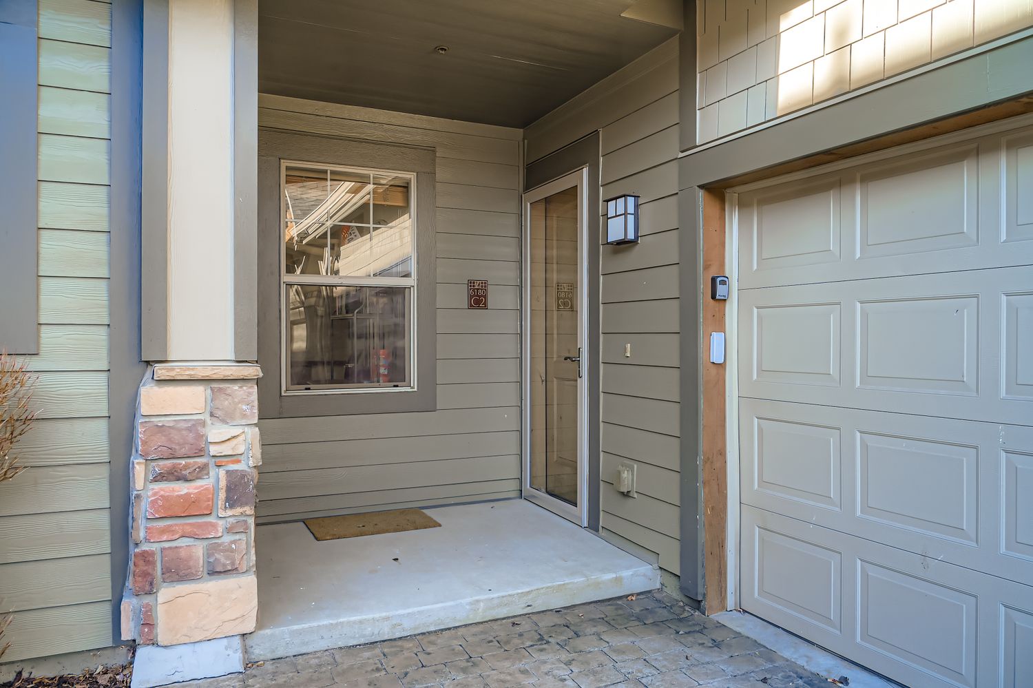 Welcome to your home base - the front entrance features modern siding and convenient garage access for easy arrivals.