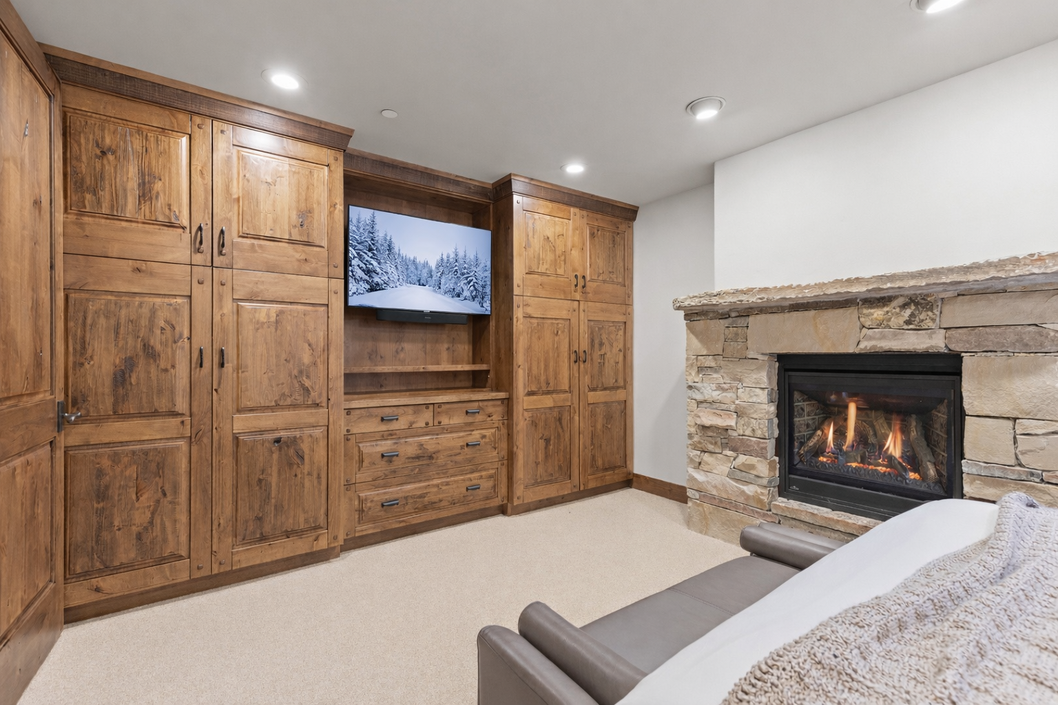 Unwind by your crackling fireplace with entertainment center and ample storage in this cozy mountain retreat.