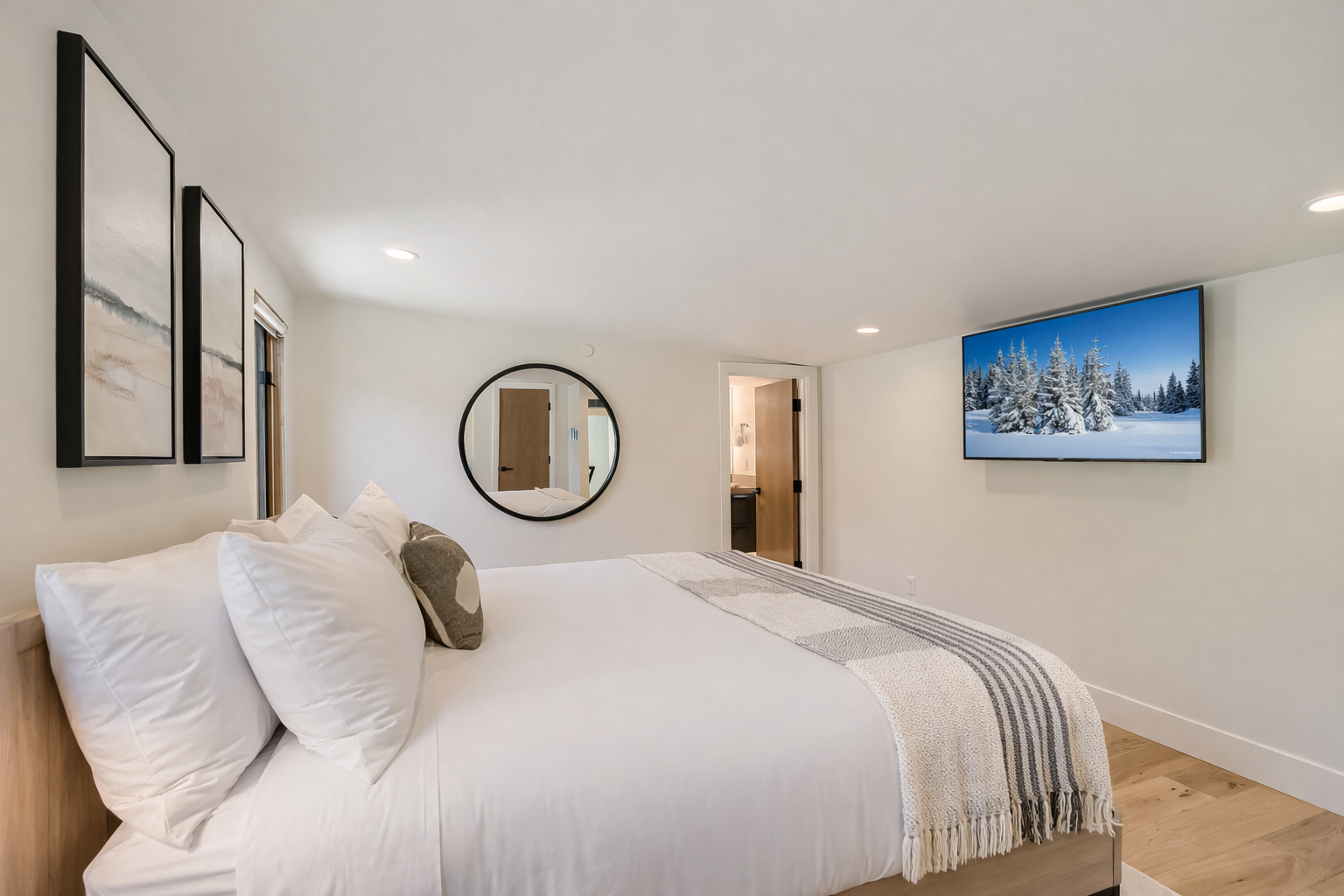 Retreat to the elegant mother-in-law suite featuring a plush king-size bed and a private, modern ensuite bathroom.