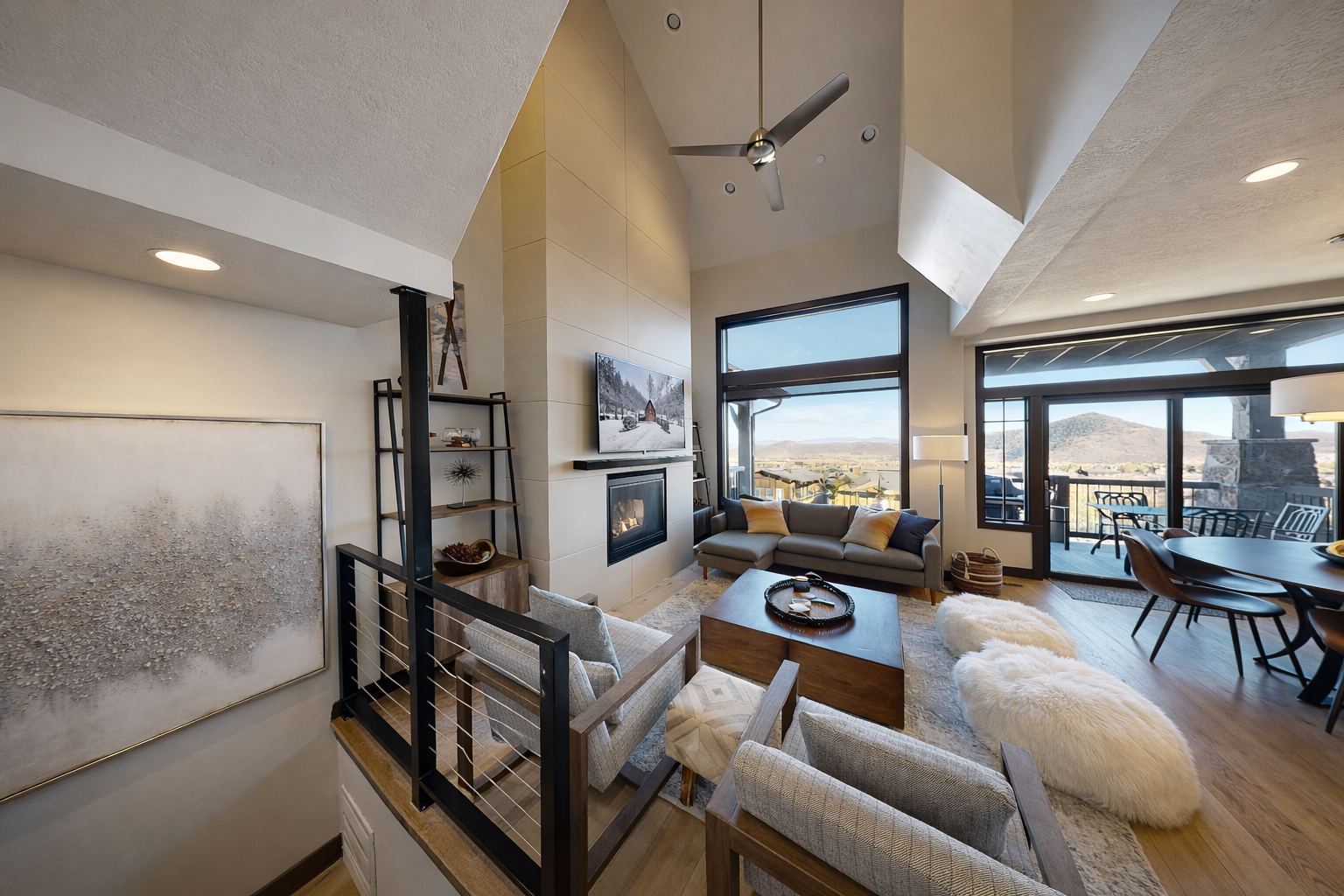 Cozy up by the fireplace in your stylish living room with stunning mountain views and modern comfort.