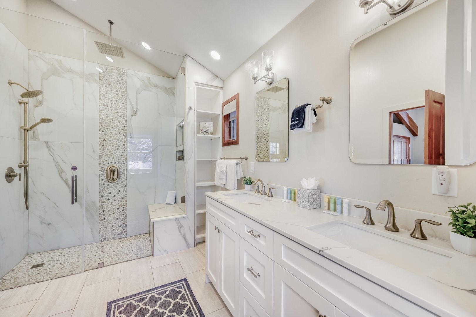 Step into your luxurious marble bathroom with spacious walk-in shower, dual vanities, and elegant finishes for ultimate relaxation.