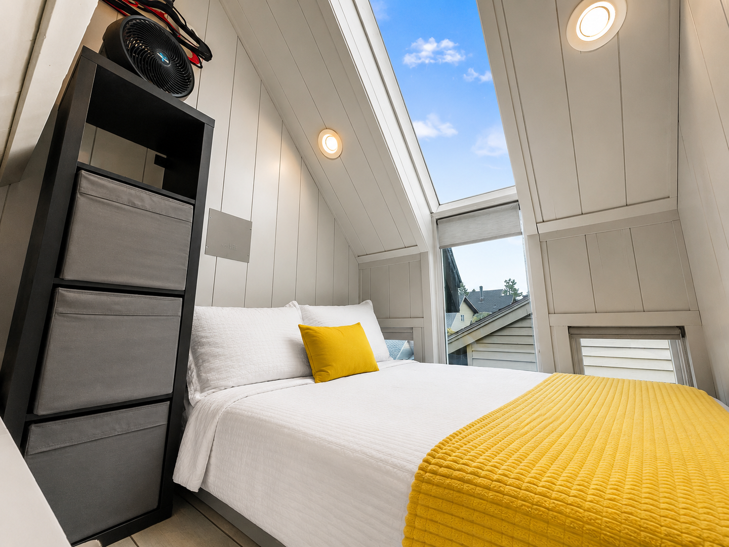 Wake up to sunshine streaming through the skylight above your cozy bed. Bright, modern, and perfectly peaceful—your restful retreat awaits beneath open skies.