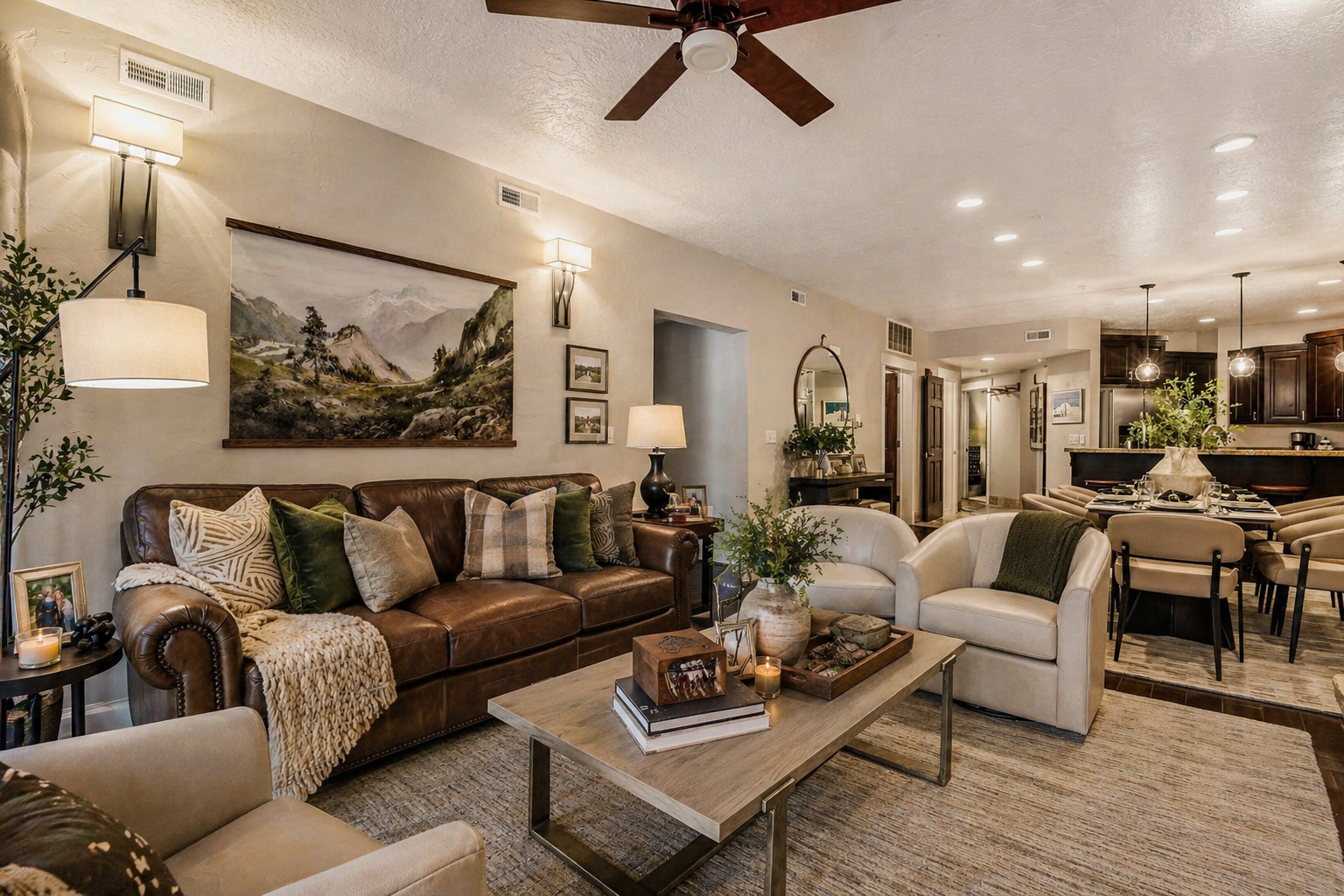 Unwind in your spacious living room, where a plush leather sofa and inviting chairs create the perfect spot to relax after exploring nearby trails and peaks.