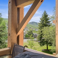 Relax on your private deck with mountain views, soak in the hot tub, and enjoy morning coffee at your bistro table.