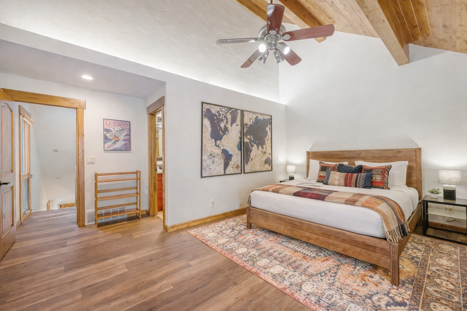 Unwind in your spacious master suite featuring exposed beam ceilings, rich hardwood floors, and thoughtful touches that create a perfect mountain retreat.
