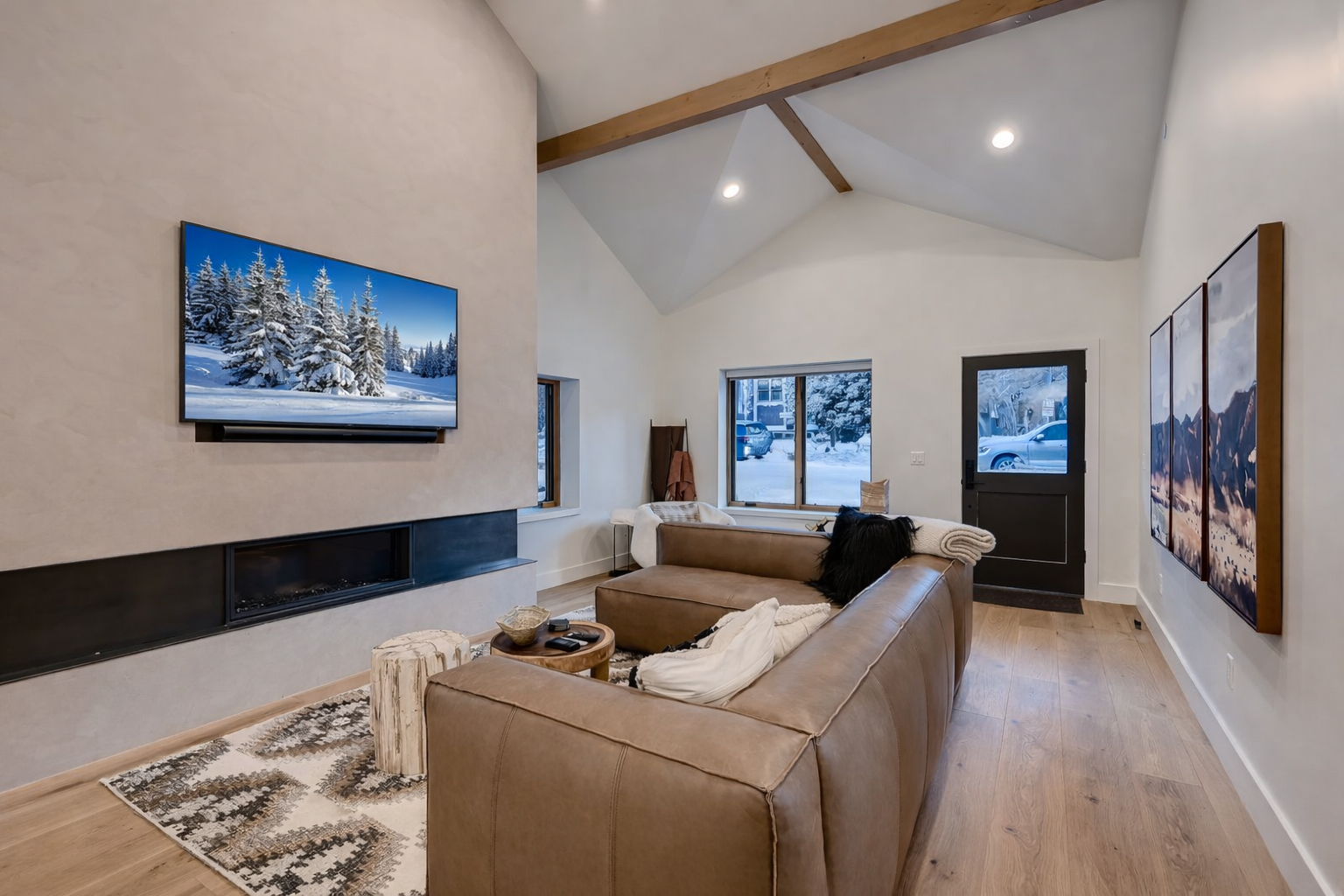 Unwind in the bright, vaulted living room with a spacious leather sectional and charming dining area.