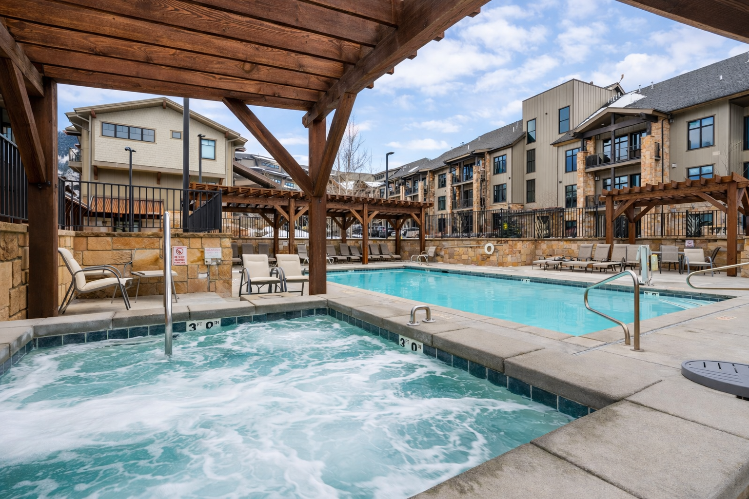 Enjoy resort-style living with access to a year-round heated pool and large hot tub! This amenity area provides the perfect setting for relaxation after a day on the slopes or a summer hike.
