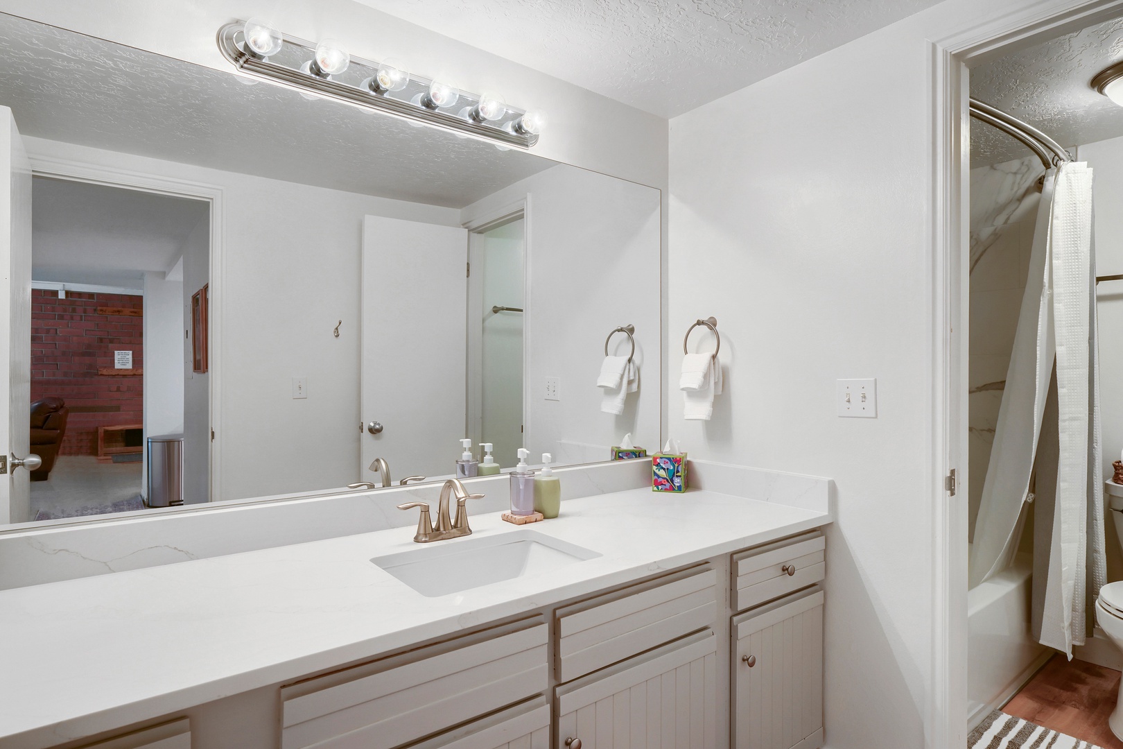 Freshen up in your bright, spotless bathroom with ample counter space and soft lighting to start your day right.