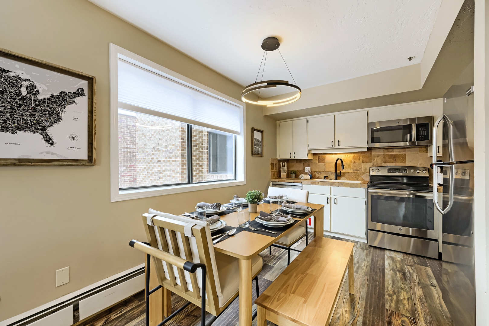 Picture yourself preparing a home-cooked meal in this fully equipped kitchen and dining for four at the cozy table. Modern appliances and warm lighting set the tone for your stay.