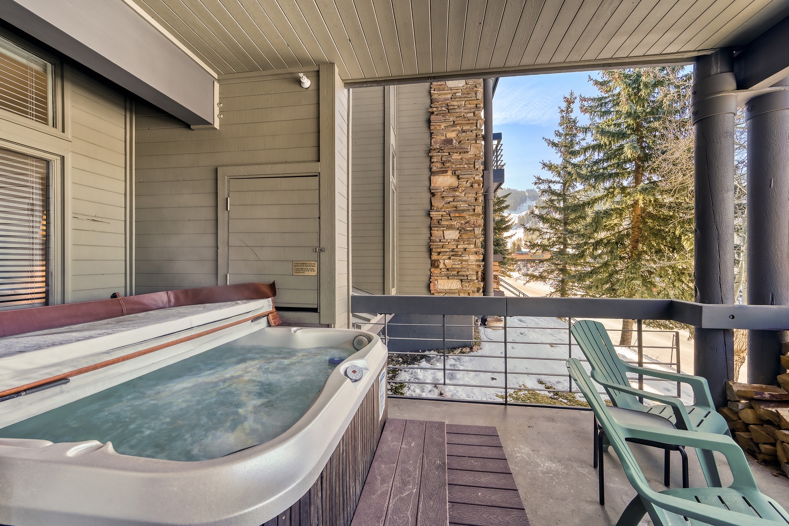 Unwind in your private hot tub on the balcony, where mountain breezes and evergreen views create the perfect alpine escape for relaxation.