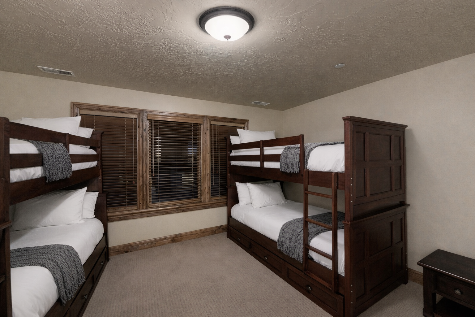 Cozy bunk bed room perfect for families, with comfortable white linens and warm wood details for restful nights.