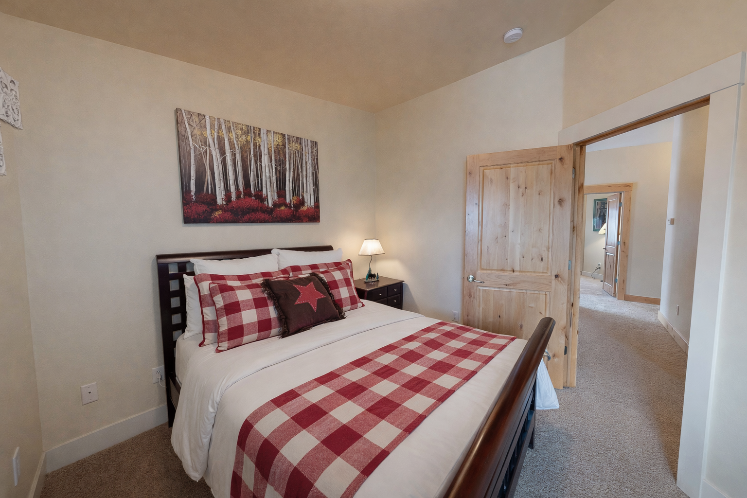 Stay in this mountain-inspired bedroom featuring a queen bed and cozy accents. Part of a luxury Park City townhome just 2 miles from the Canyons ski slopes.