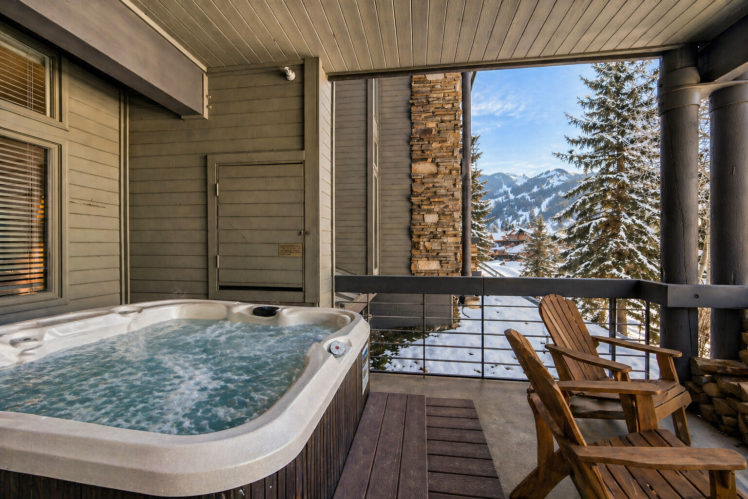 Unwind in your private hot tub while savoring breathtaking mountain views from your cozy terrace.