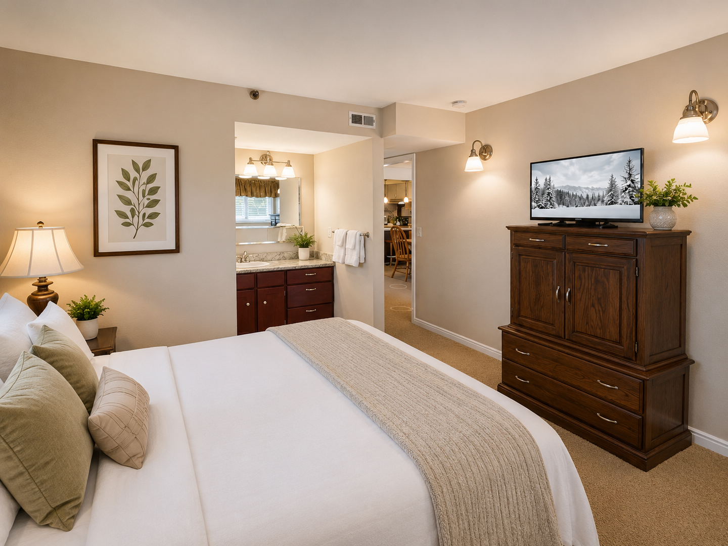 Cozy mountain retreat! Relax in this inviting king room with warm lighting, wood furniture, and an ensuite bath.