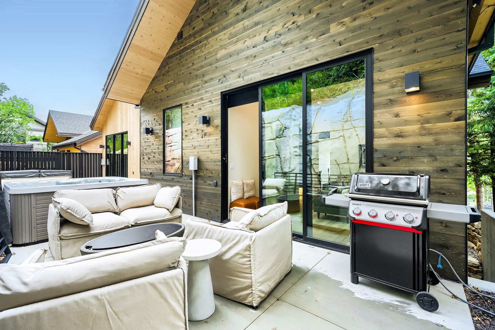 Unwind on your private patio with plush seating perfect for morning coffee or evening stargazing. Fire up the grill for a cookout, then soak under the stars in your personal hot tub.