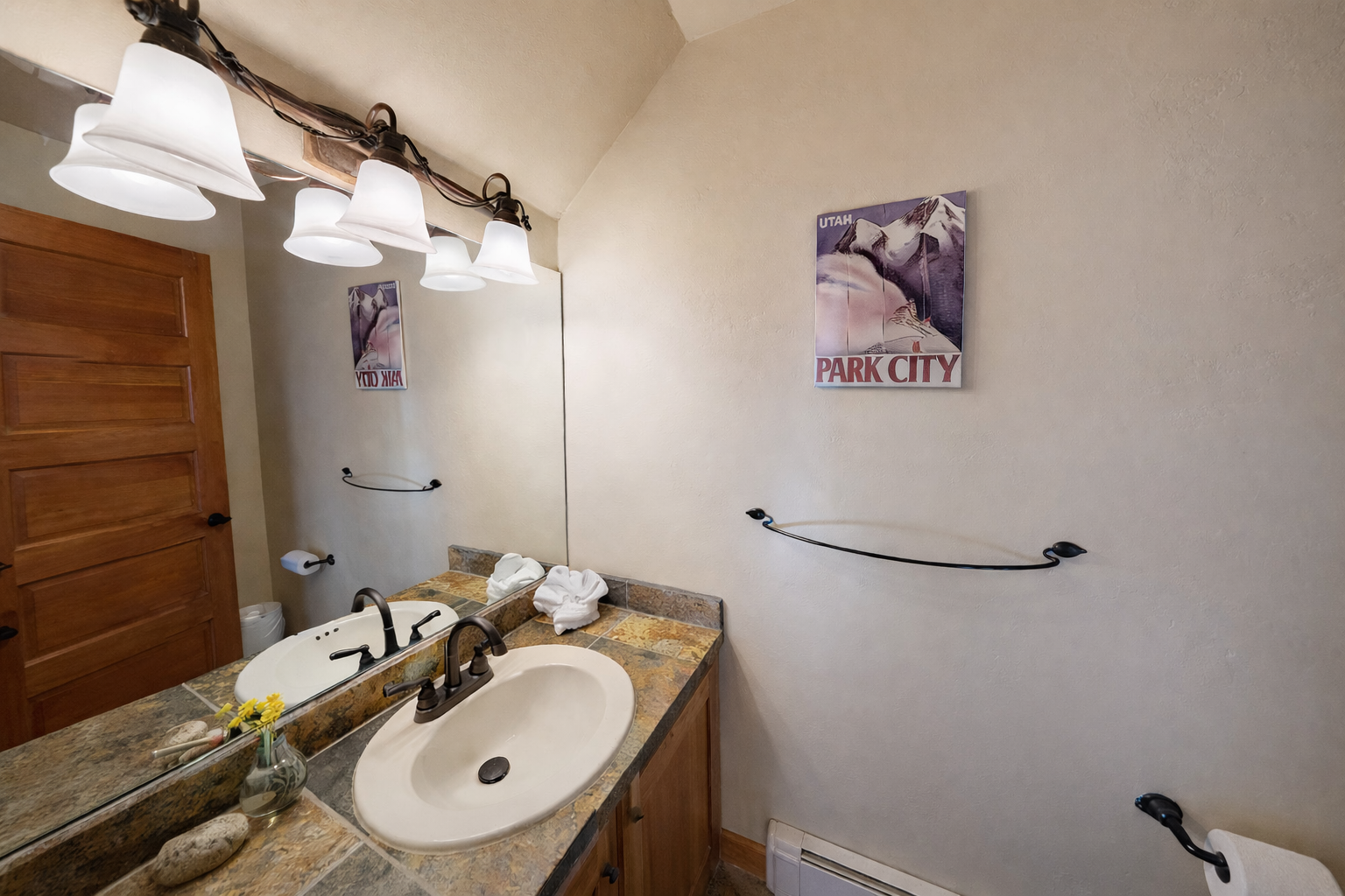 Modern and clean main floor powder room with charming local touches. Perfect for a quick refresh while staying in Park City.