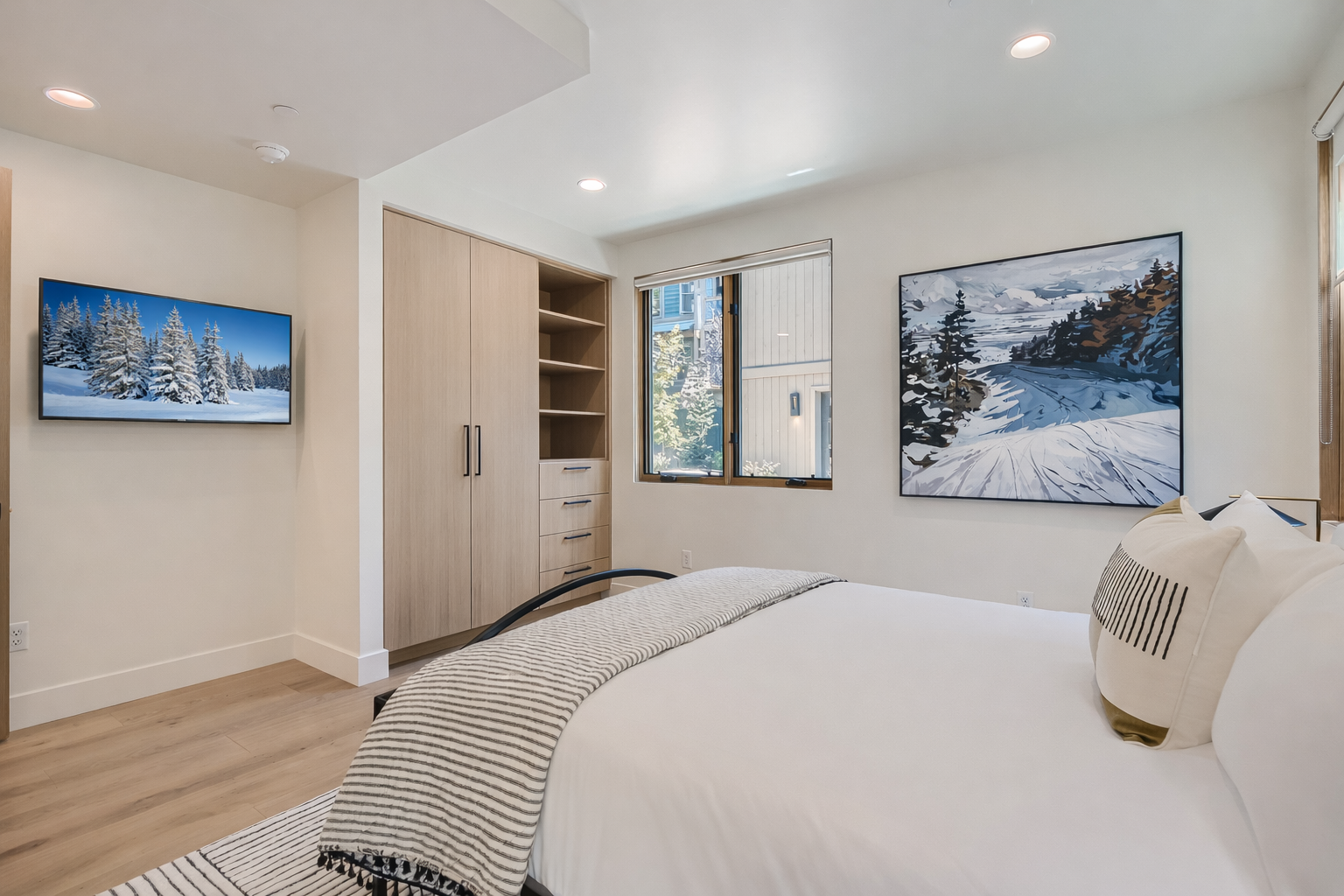 Retreat to the charming queen guest room featuring a cozy bed, stylish decor, and a convenient, modern ensuite bathroom.