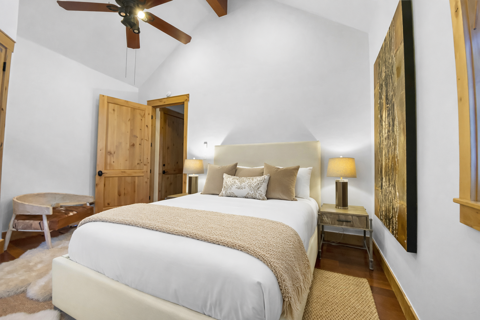 Unwind in this serene bedroom where crisp linens and soft lighting create your perfect retreat.