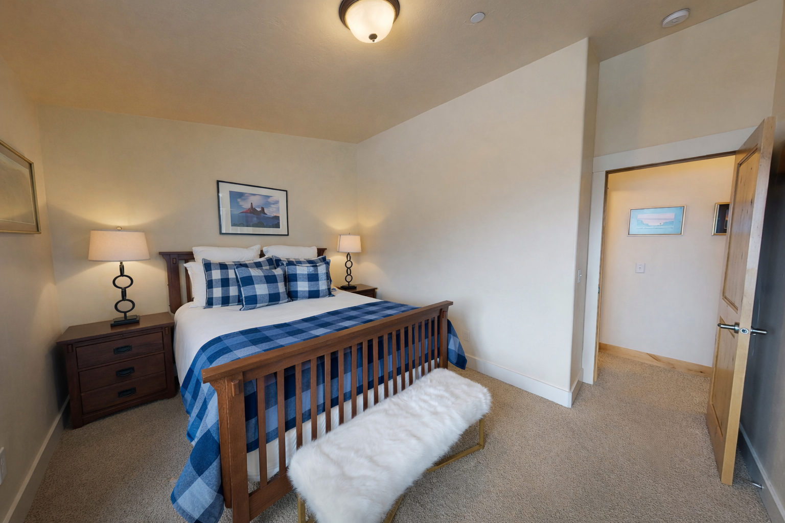 Drift off peacefully in your cozy bedroom with plush bedding and a workspace by the window for morning coffee and planning your day.