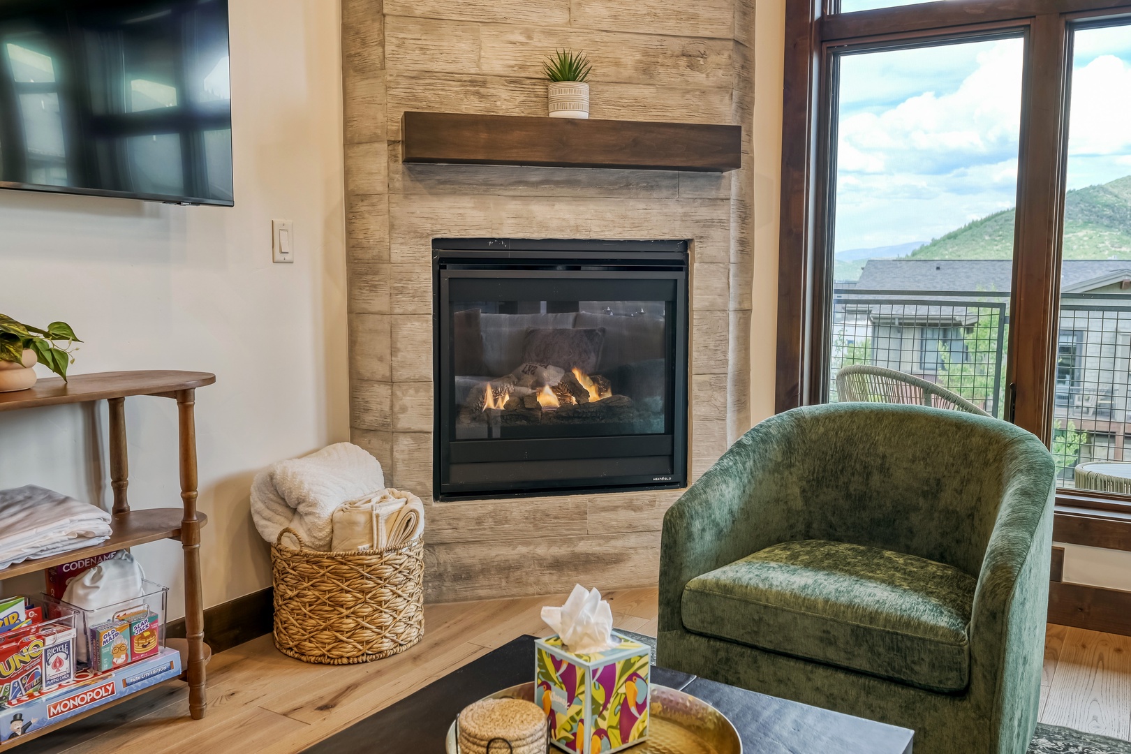 Cozy up by the fireplace with mountain views framing your stay—perfect for quiet evenings or peaceful mornings with your favorite book.