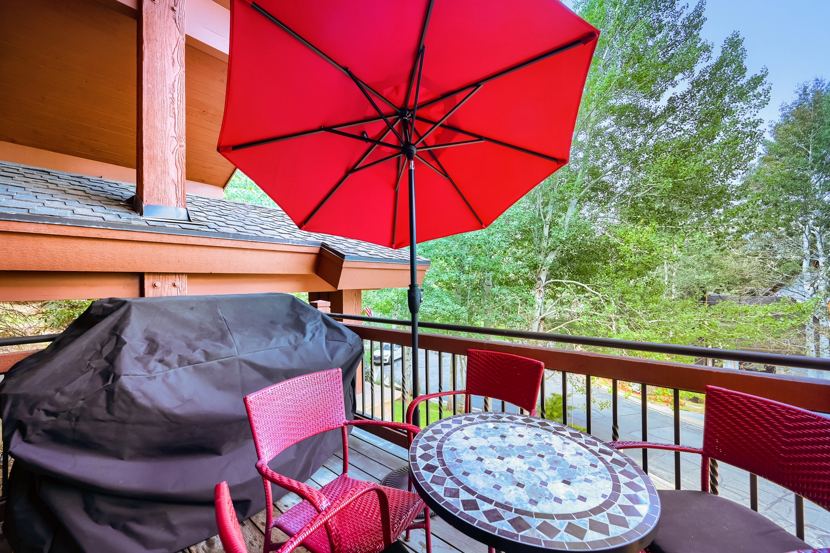Balcony/ Patio with a BBQ and seating to relax outside and enjoy the Natural Landscape