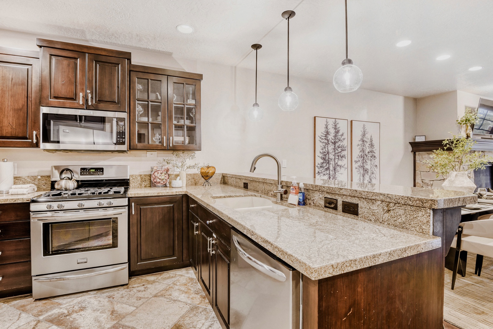 Your gourmet kitchen awaits with granite countertops, stainless steel appliances, and elegant pendant lighting for memorable meal prep.