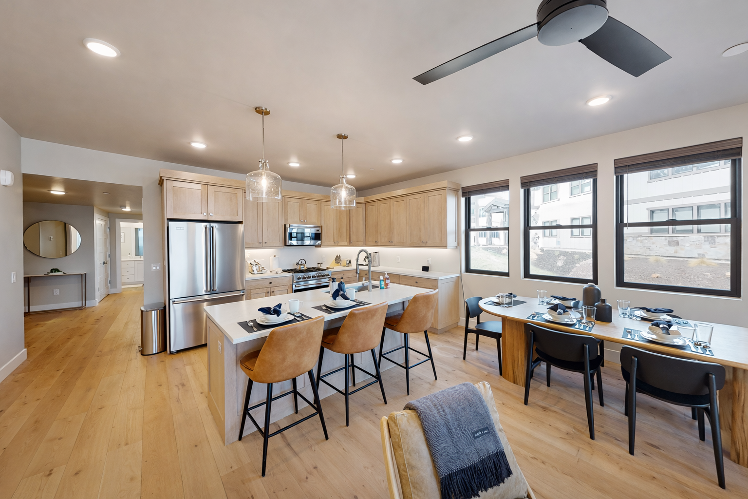 Host large groups in this modern Park City living space. Features a gourmet kitchen, sleek stone fireplace, and stunning mountain views—the perfect year-round alpine retreat!