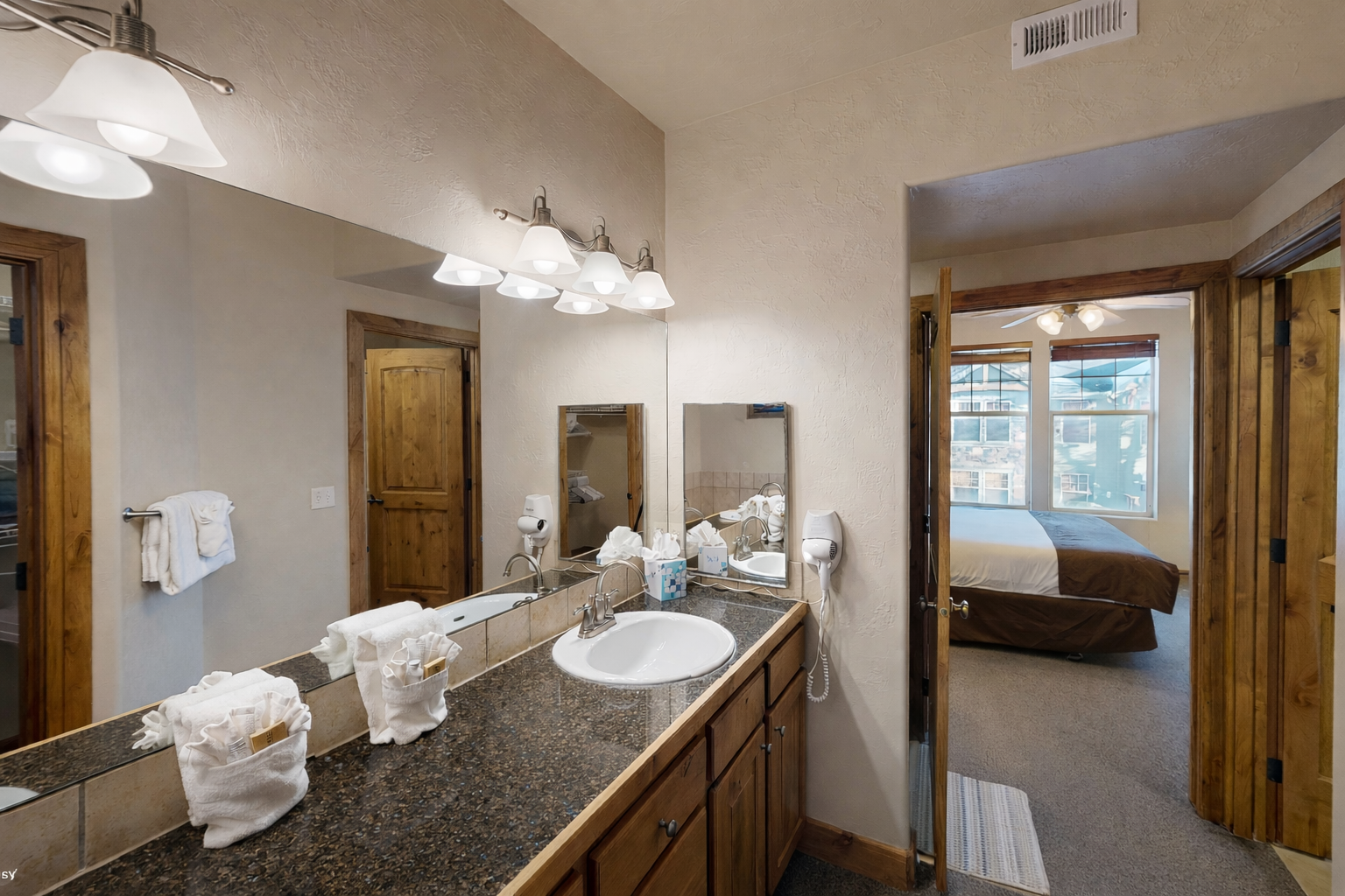 Spacious bathroom featuring a convenient double vanity and a relaxing tub/shower combination. Enjoy ample counter space, storage, and lighting for a seamless morning routine!