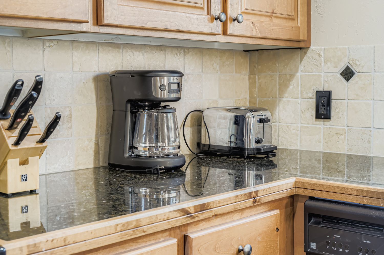 Your fully equipped kitchen features quality appliances including a coffee maker and toaster for convenient meal preparation during your stay.