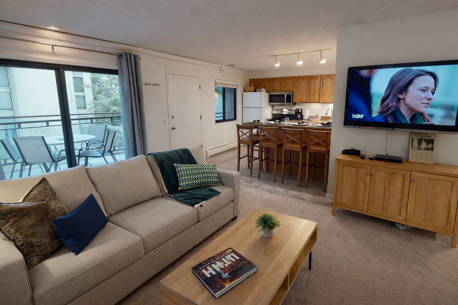 Relax in your spacious living room with plush seating, modern kitchen, and entertainment center—your perfect home away from home awaits.